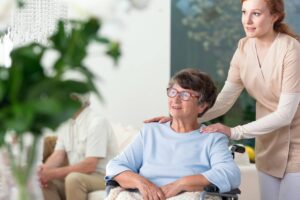 Caregiver Taking Care Of Disabled Elderly Woman In T3mk7b4 1