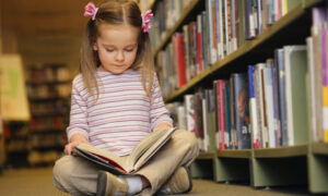 Young Girl Reading In Lib 001